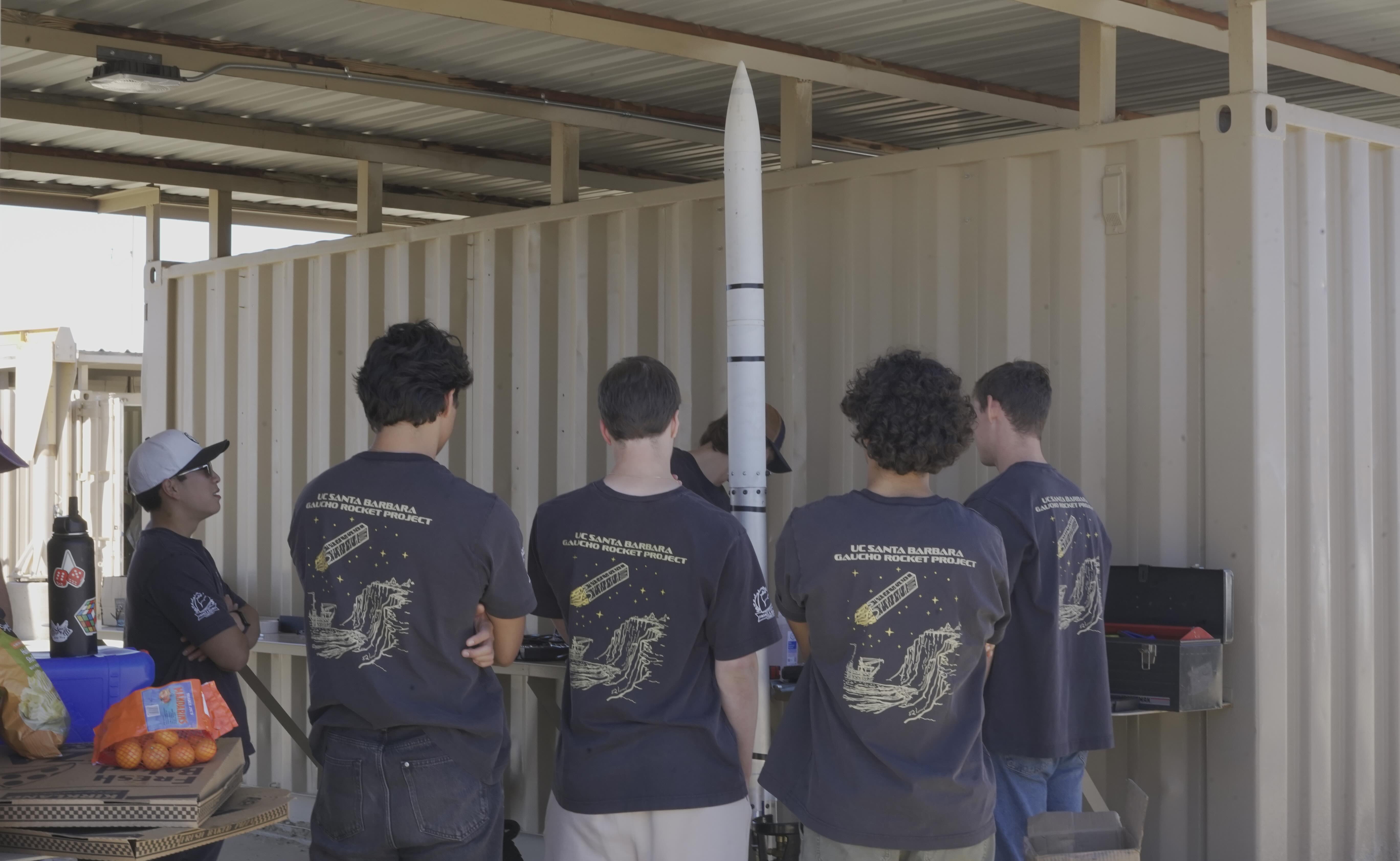 A rocket lifting off from the launch rail